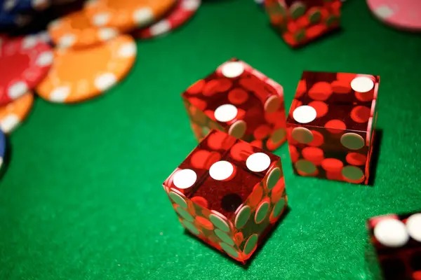 Live casino dealer managing a roulette table with multi-camera view